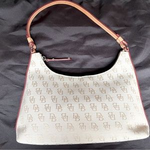 Dooney & Bourke baguette. Never used. Bone DB fabric with leather strap and trim